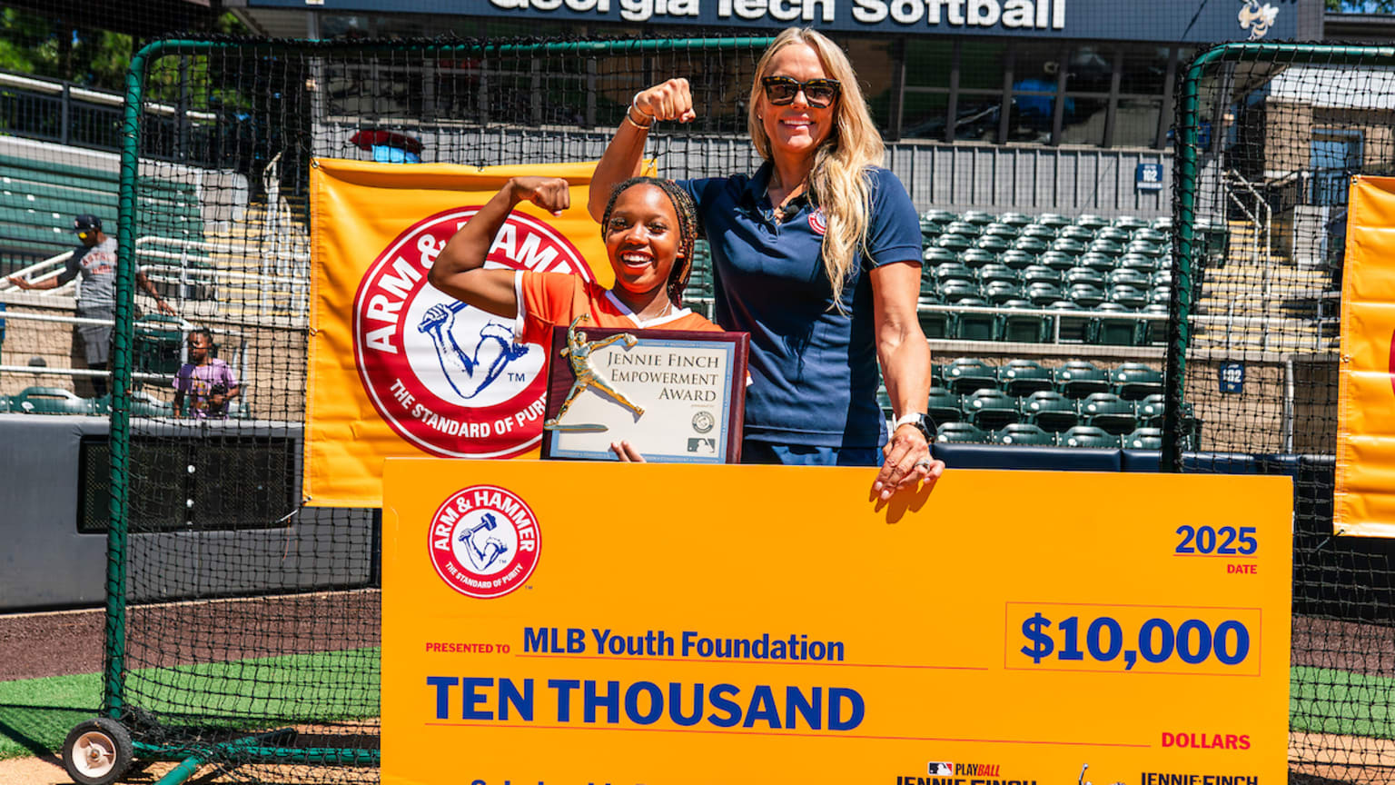 Kourtney Jones-Caldwell poses with Jennie Finch