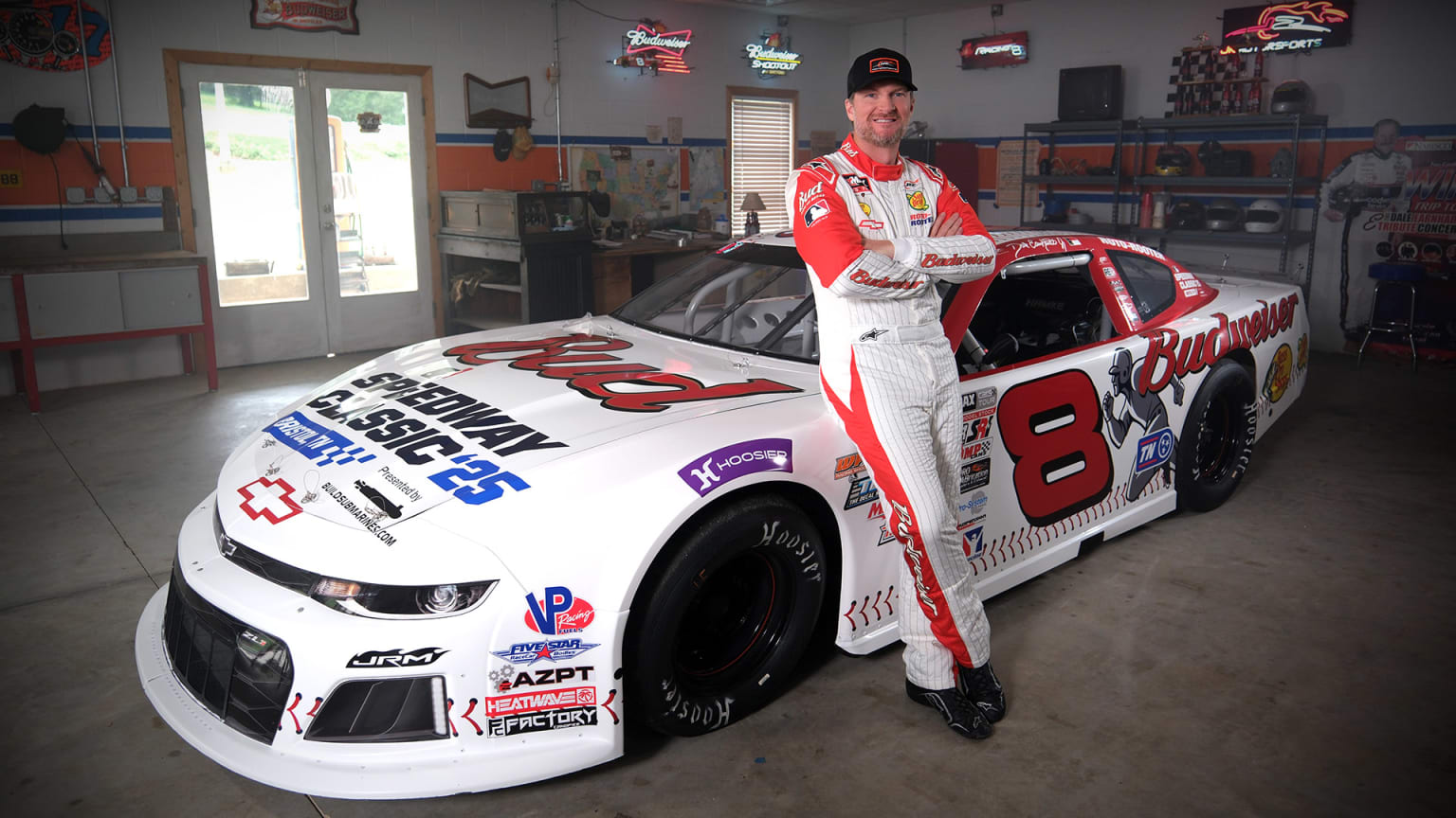 Dale Earnhardt Jr. poses with his No. 8 race car designed for the 2025 Speedway Classic
