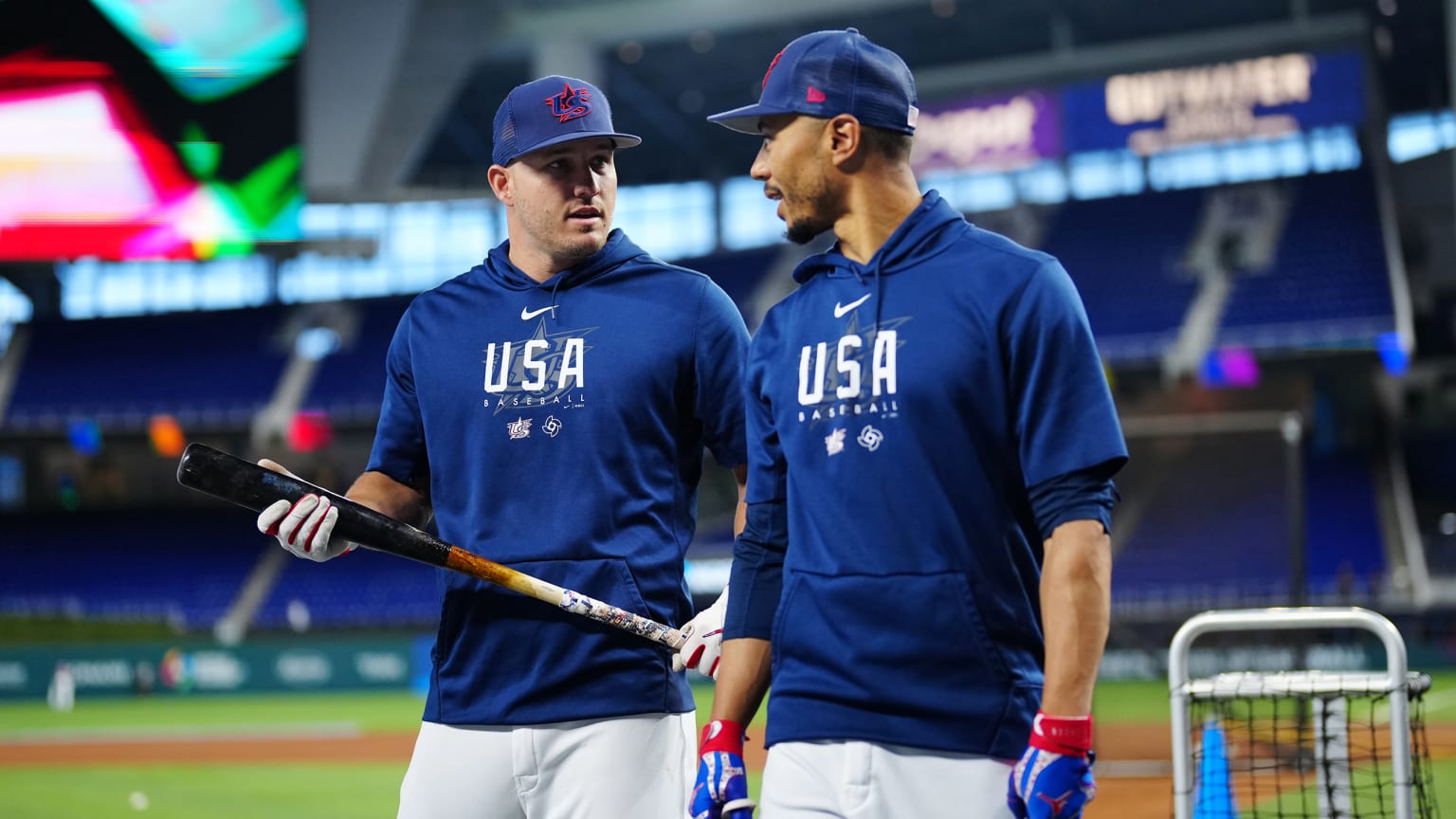 Mike Trout and Mookie Betts talk on the field before the game