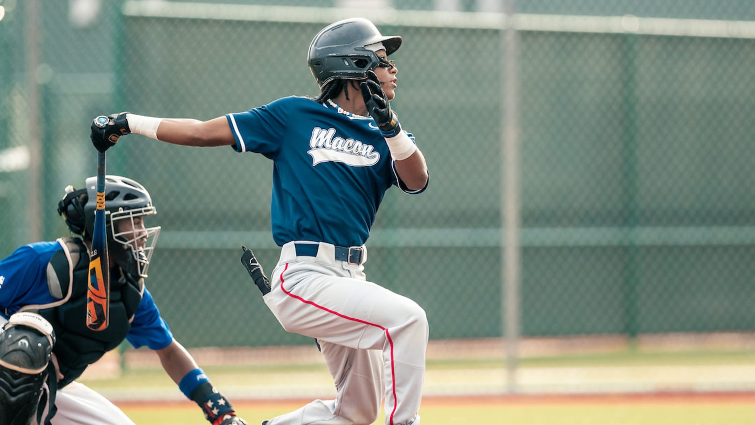 A Macon player follows through on a swing during the Nike RBI World Series