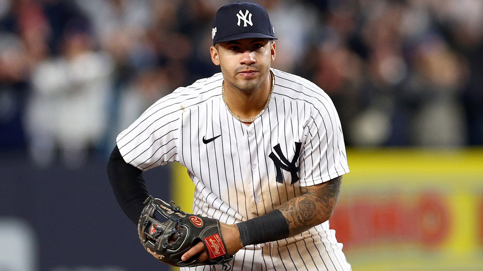 Gleyber Torres moves his arm in a motion as if he is rocking a baby