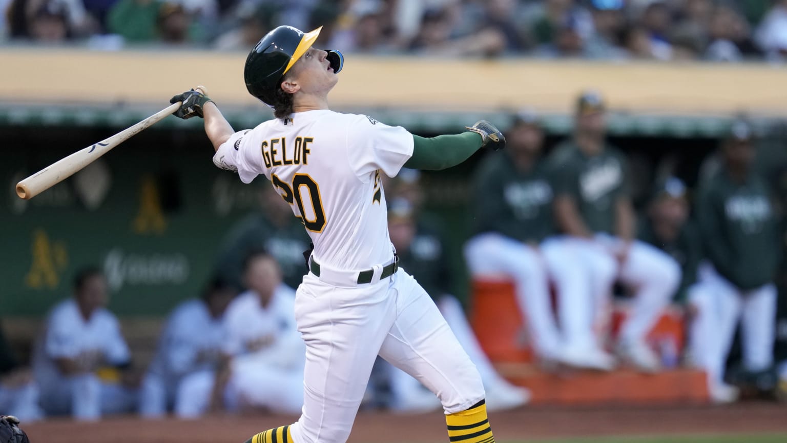 Zack Gelof watches the flight of a fly ball