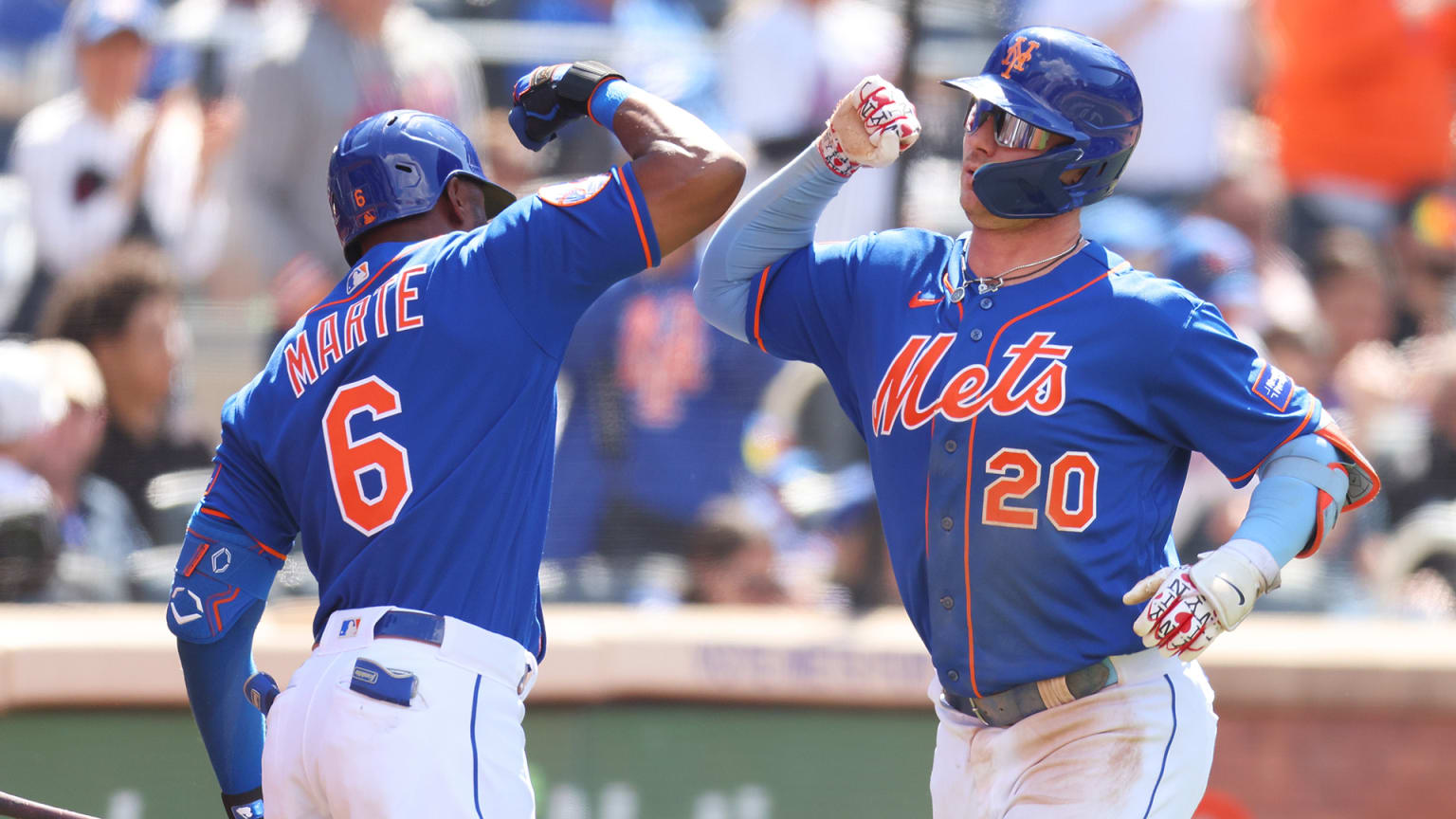 Starling Marte and Pete Alonso celebrate near home plate