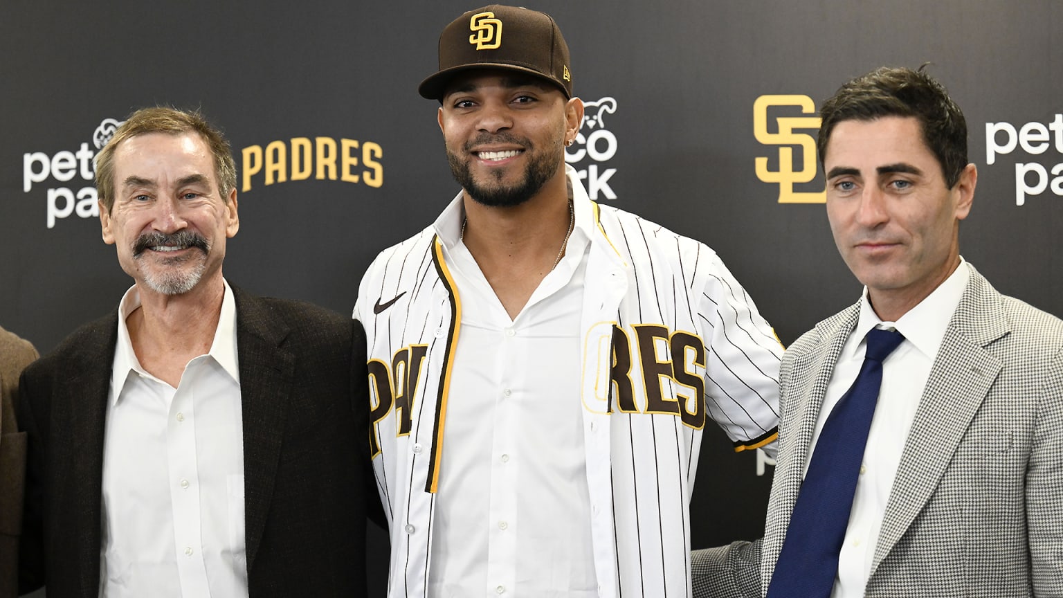 Xander Bogaerts is flanked by Padres chairman Peter Seidler and GM A.J. Preller