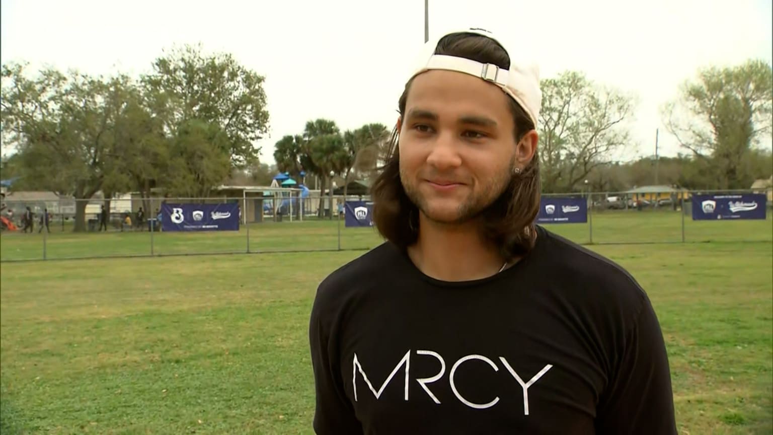 Bo Bichette is interviewed at a youth field