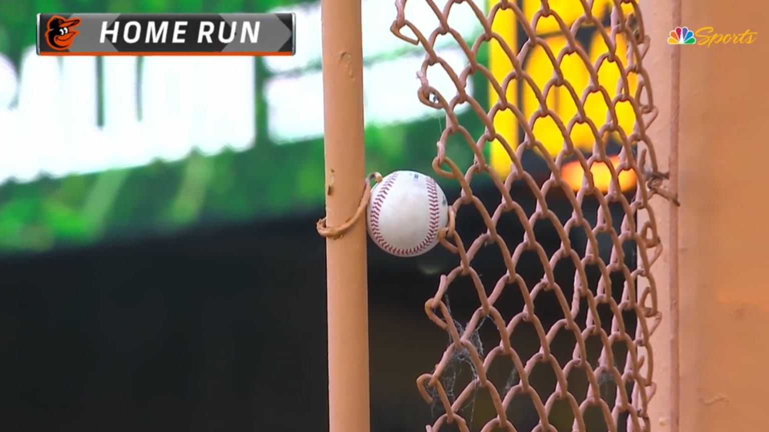 A baseball is lodged in the foul pole