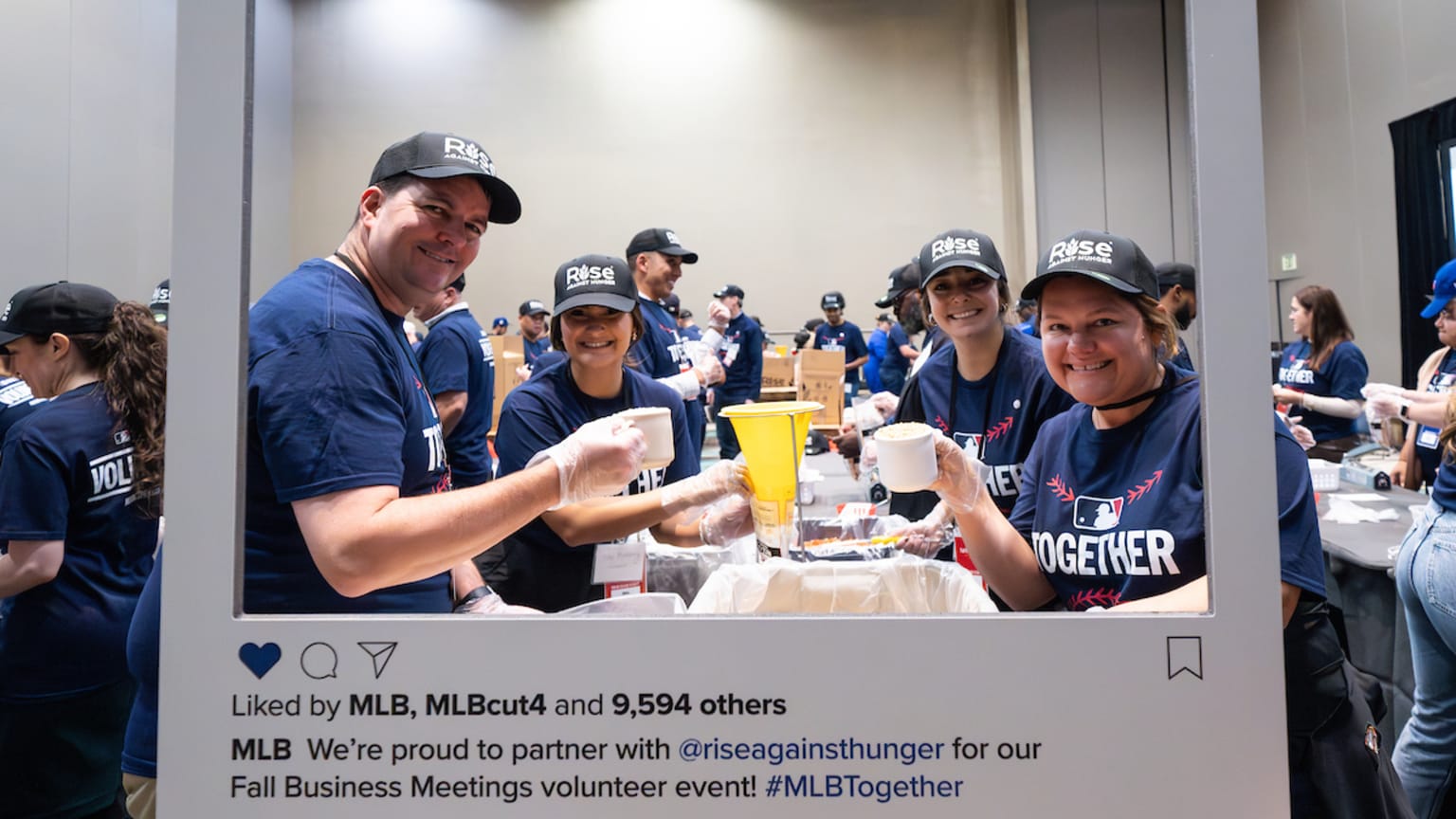 Volunteers gather to pack meals