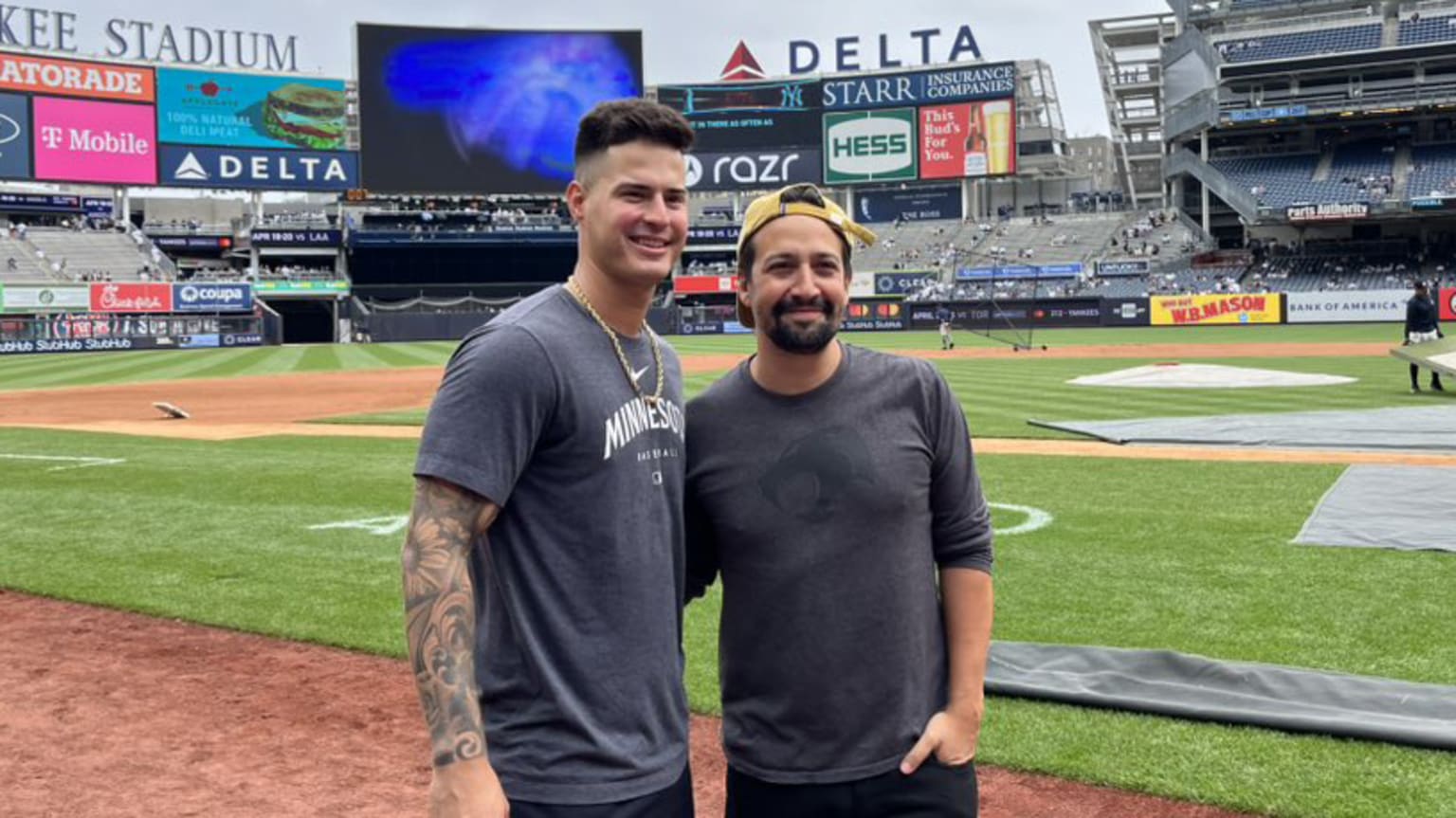 Jose Miranda and Lin-Manuel Miranda pose for a photo at Yankee Stadium
