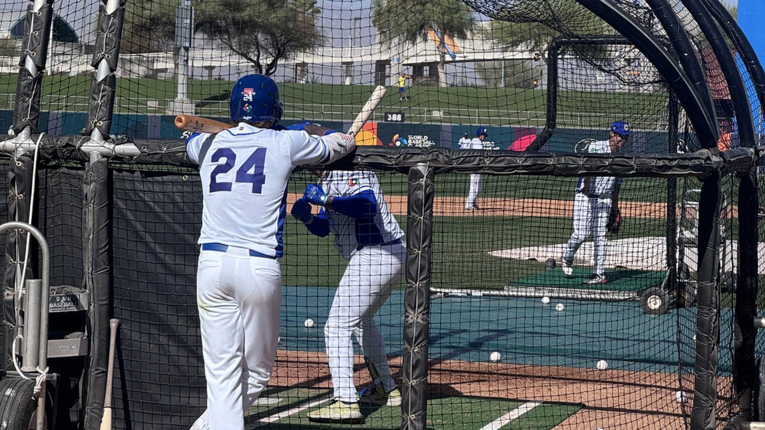 Lucas Ramírez watched batting practice from behind the batting cage