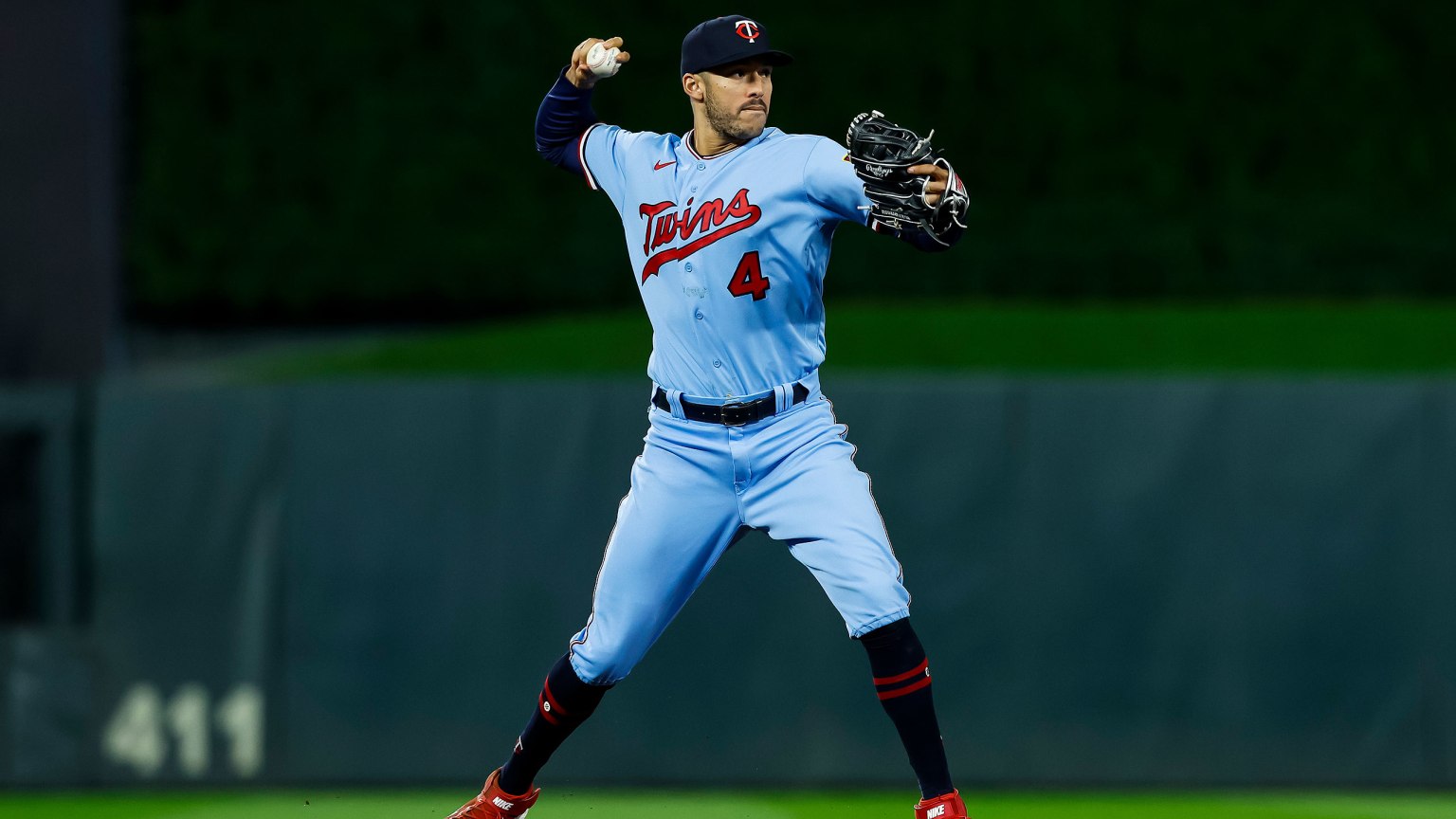 Carlos Correa is poised to throw to first base