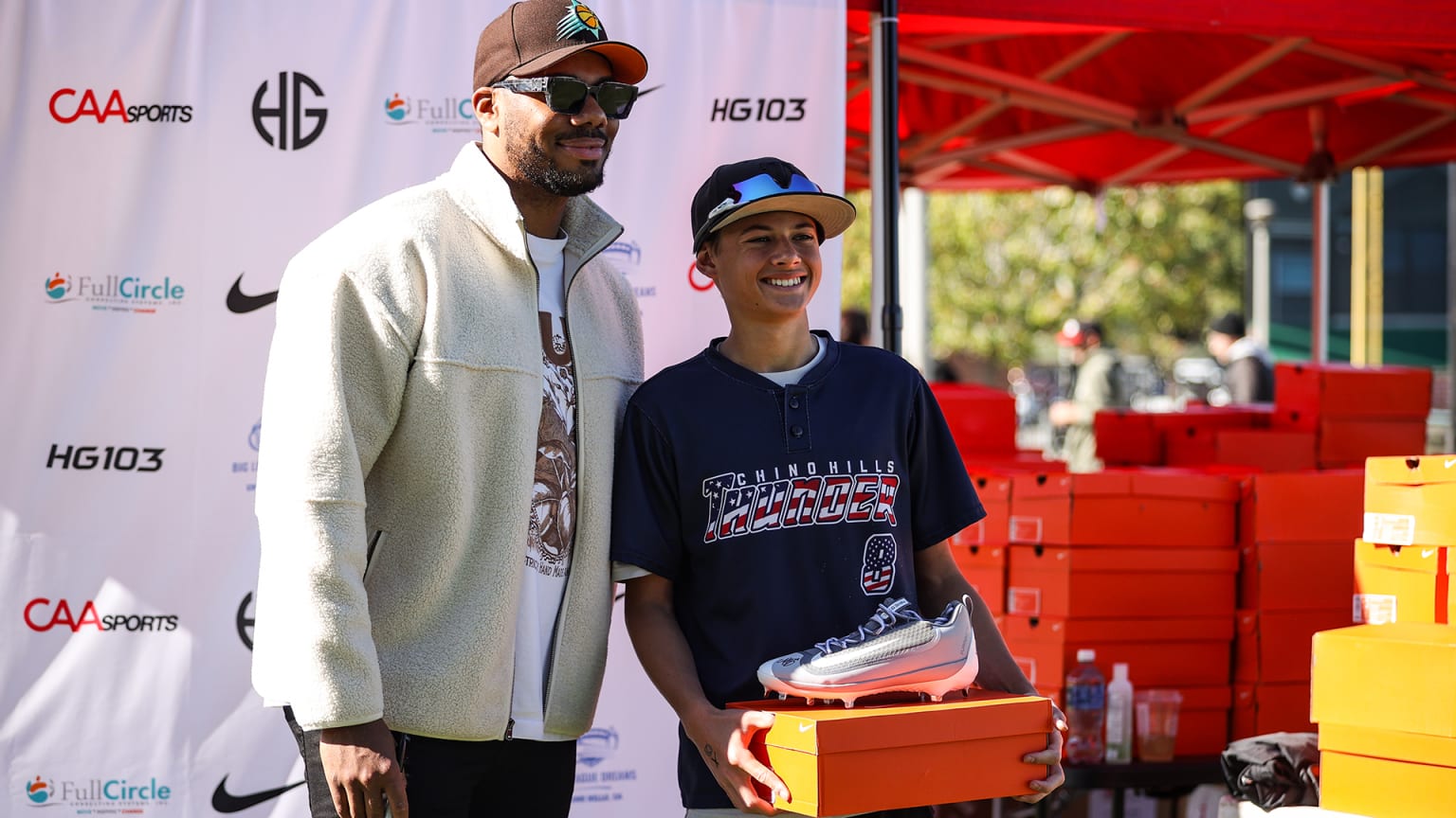 Hunter Greene poses with a young fan at a charity event