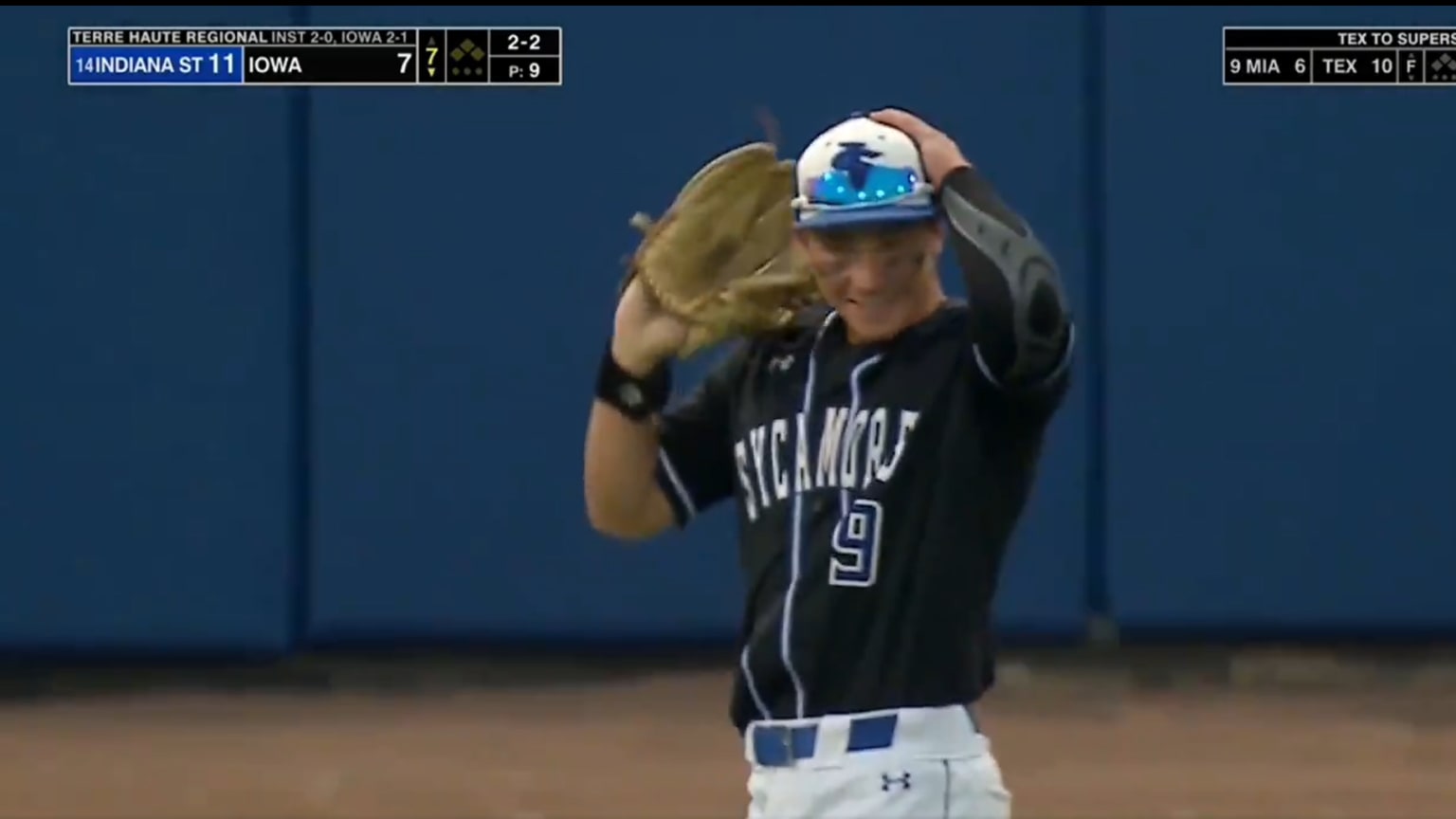 A screengrab of Indiana State's Adam Pottinger holding his hands to his head with a sheepish grin on his face