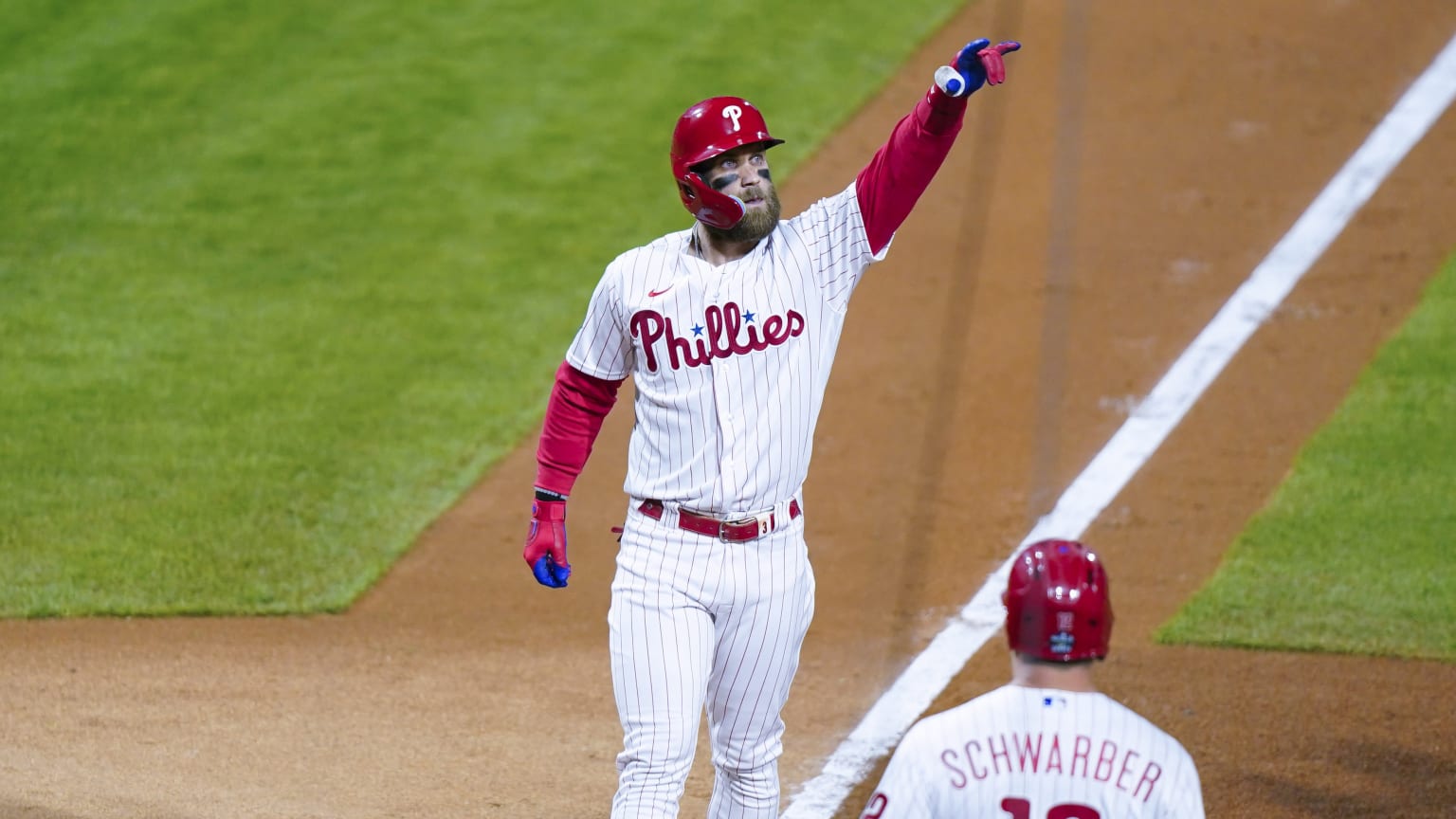 The Phillies' Bryce Harper crossing home plate