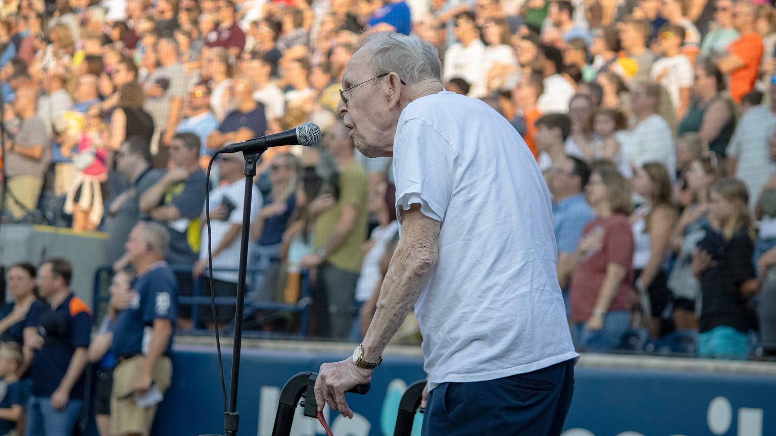 WWII veteran John Pylman sings the national anthem at a Minor League game