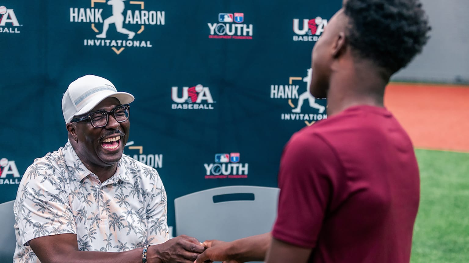 Bob Kendrick shares a laugh with a participant at the Hank Aaron Invitational