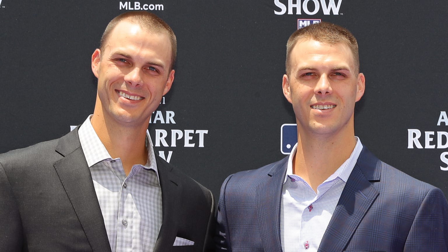 The Rogers twins stand side by side at the All-Star Game Red Carpet Show