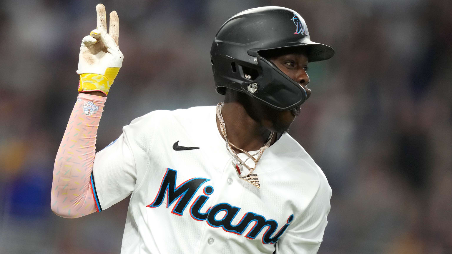 Jazz Chisholm Jr. holds up two fingers to signify his second grand slam in two days