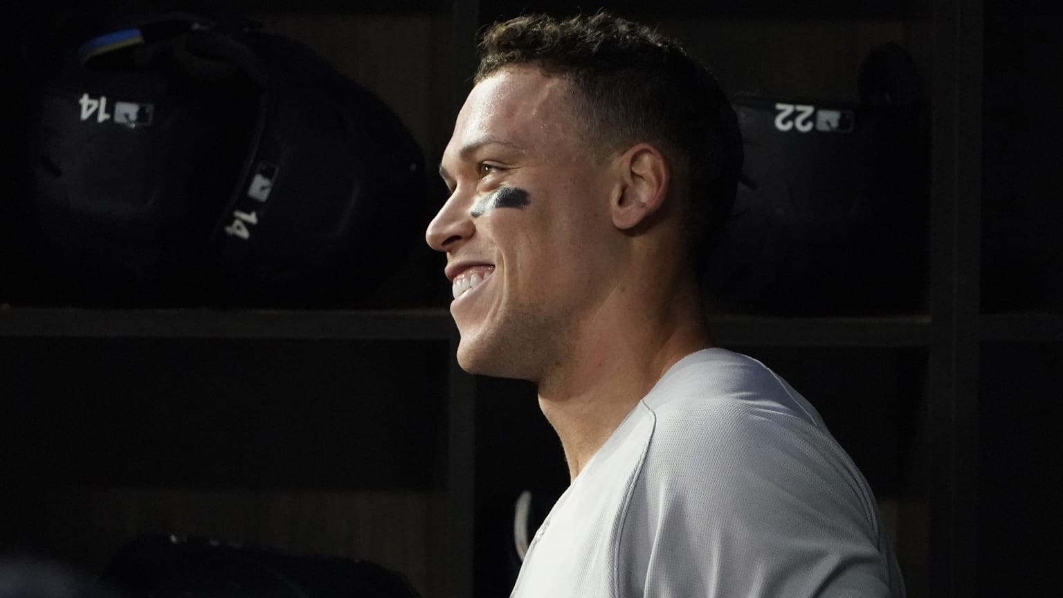 Aaron Judge smiles in the dugout