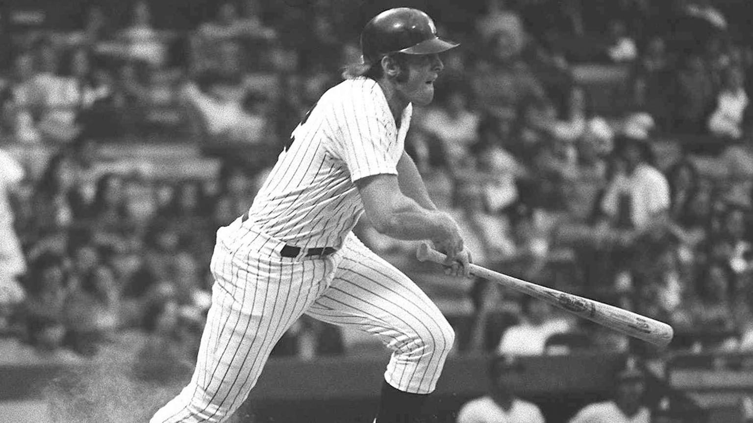 Ron Blomberg, in Yankees pinstripes, follows through on a swing