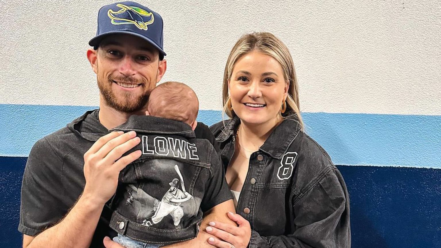 Brandon Lowe poses for a photo with wife Madison and newborn son Emmett Dean
