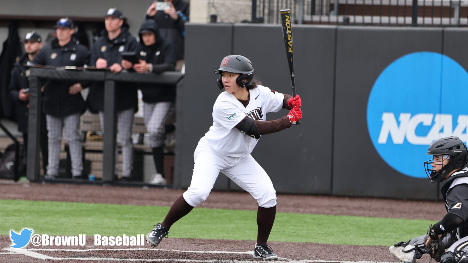 A woman at bat in a college baseball game