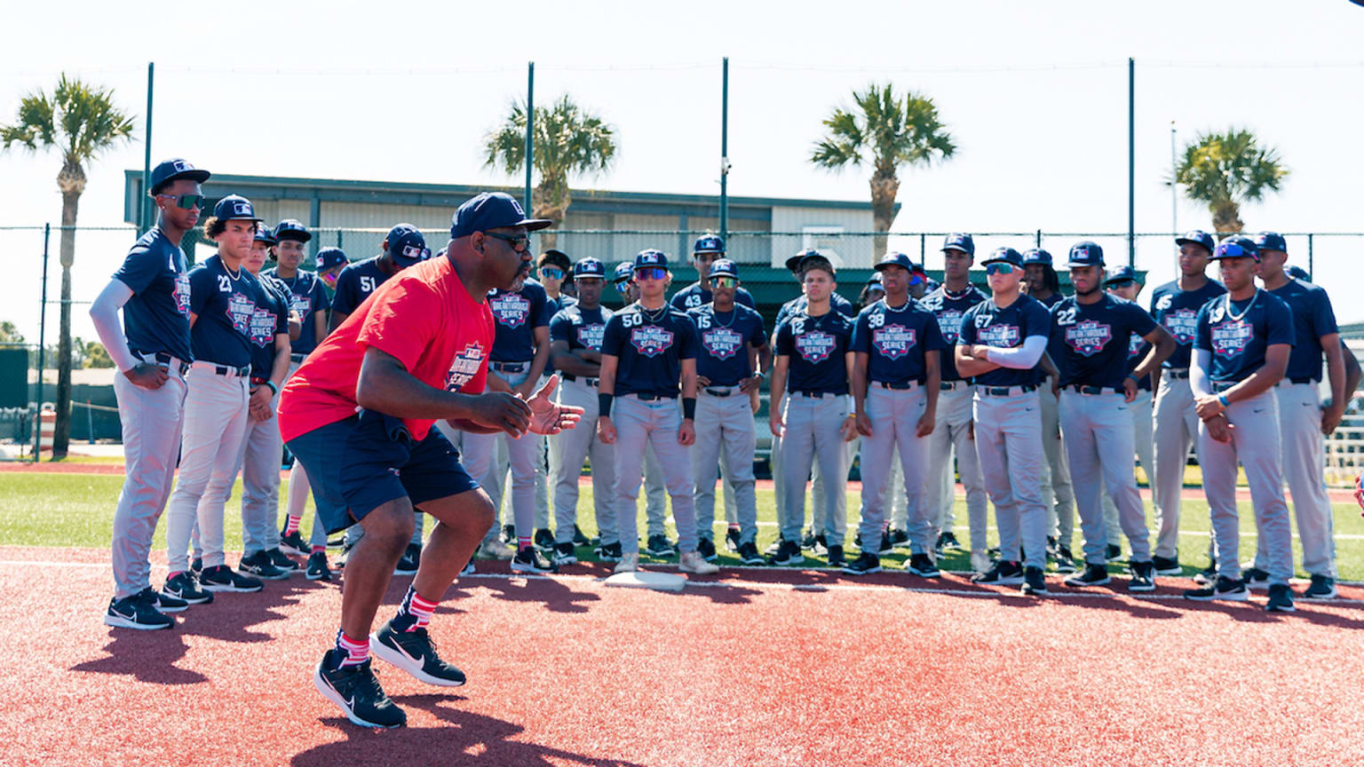 Marquis Grissom running through drills at a baseball youth event