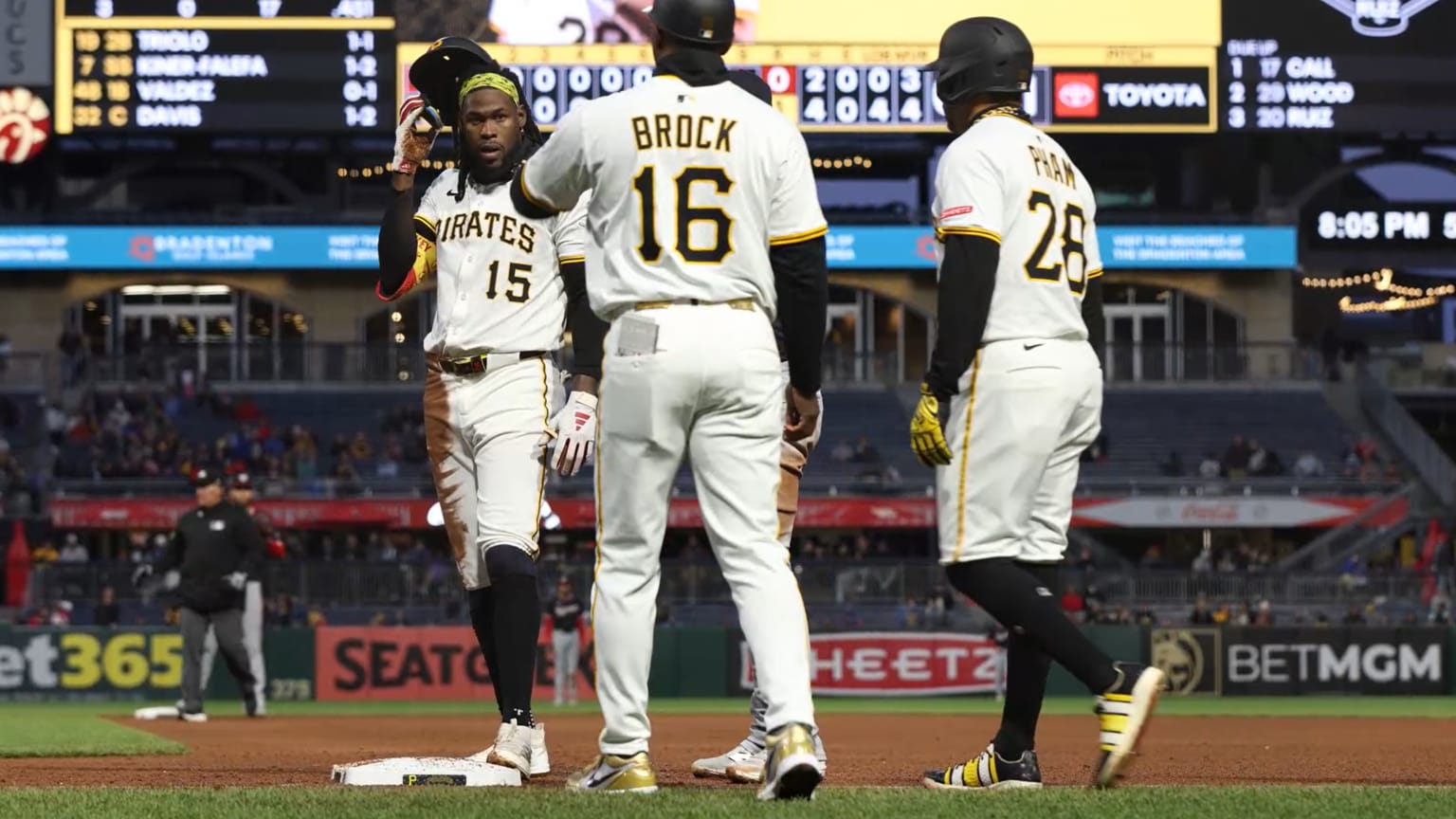Oneil Cruz and Tommy Pham on the field after Pham was thrown out at first base