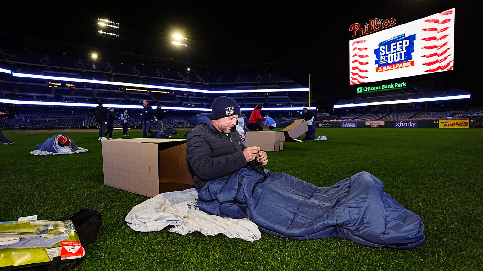 A fan in a sleeping bag on the field at Philadelphia's Citizens Bank Park