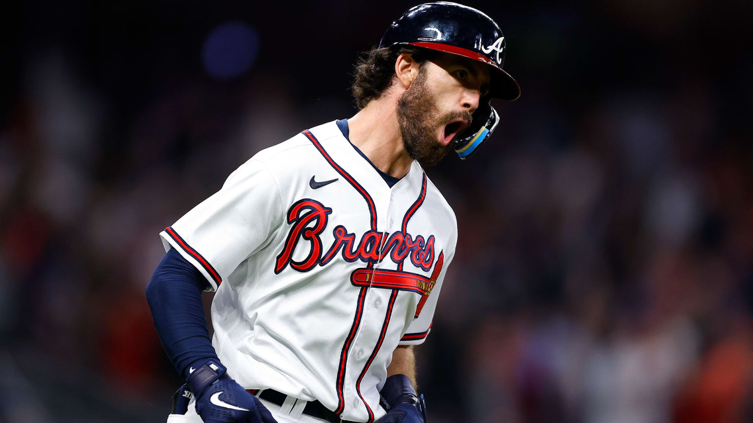 Dansby Swanson yells while rounding the bases