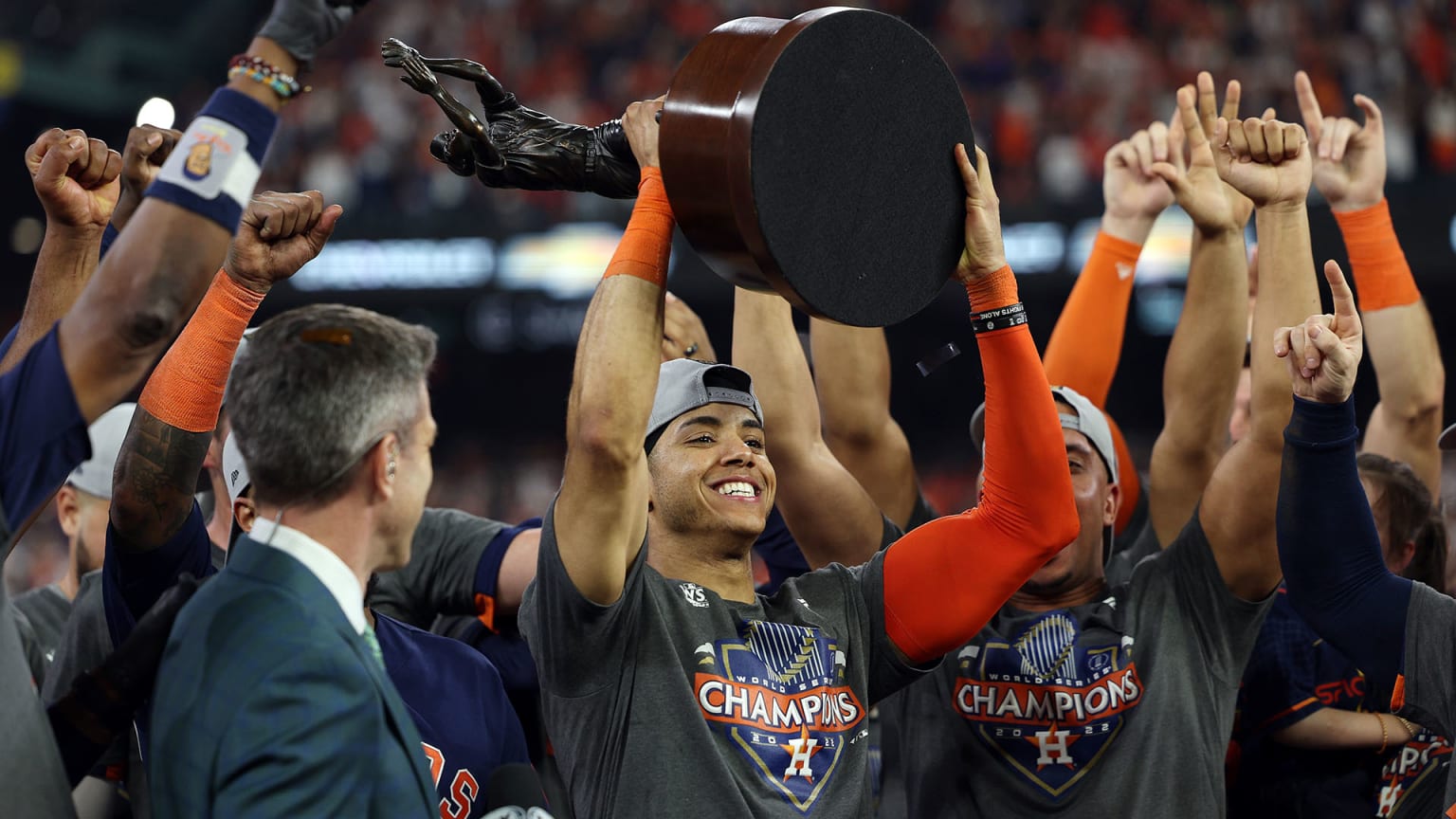 Jeremy Pena holds up the World Series MVP trophy