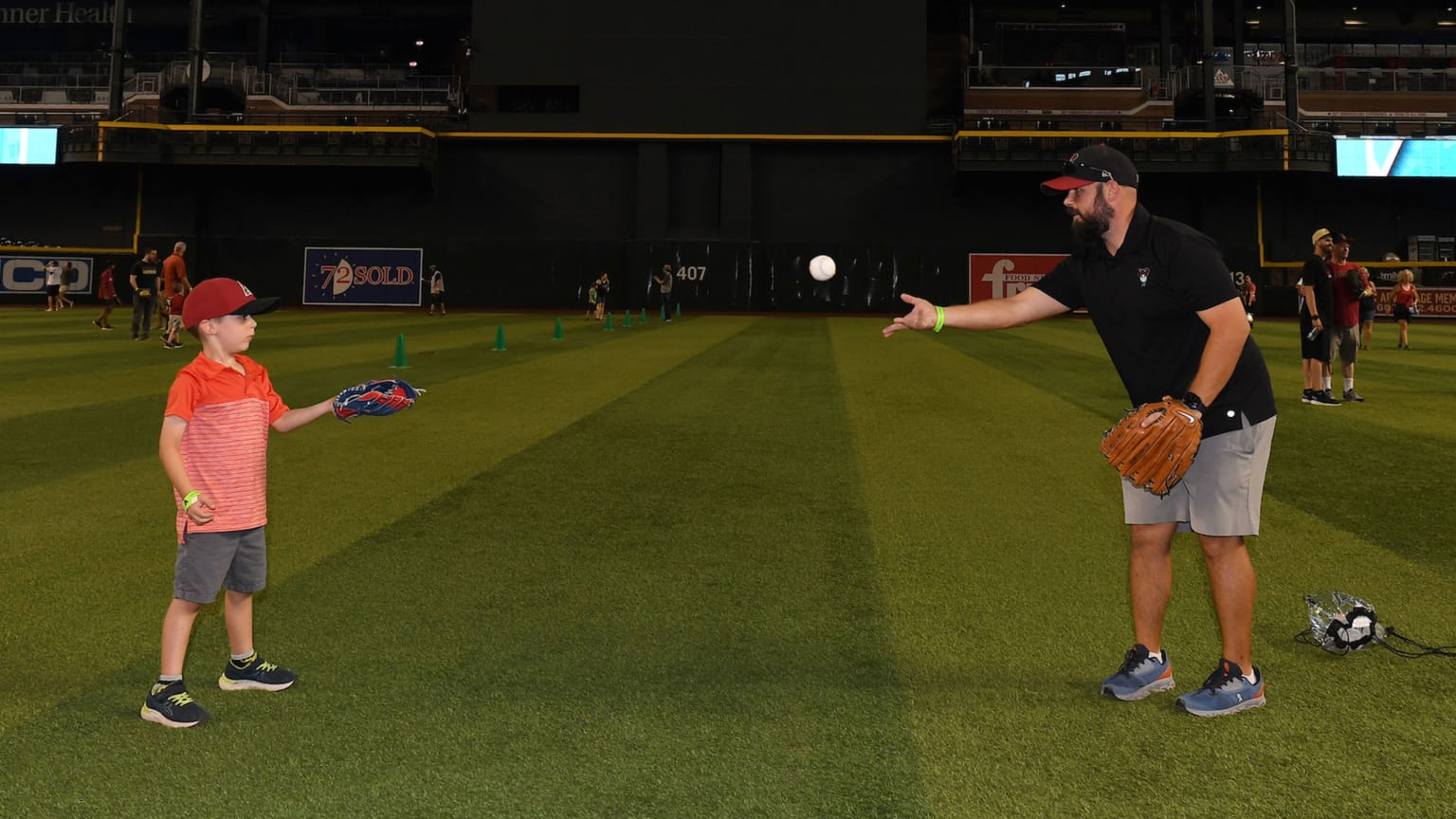 Play catch on the field before D-backs game on Father's Day