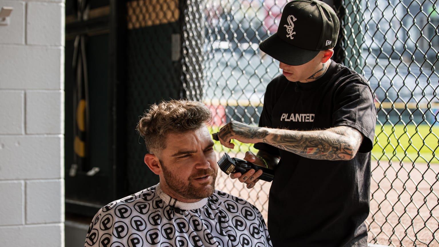 Liam Hendriks gets a haircut from Vic Blends