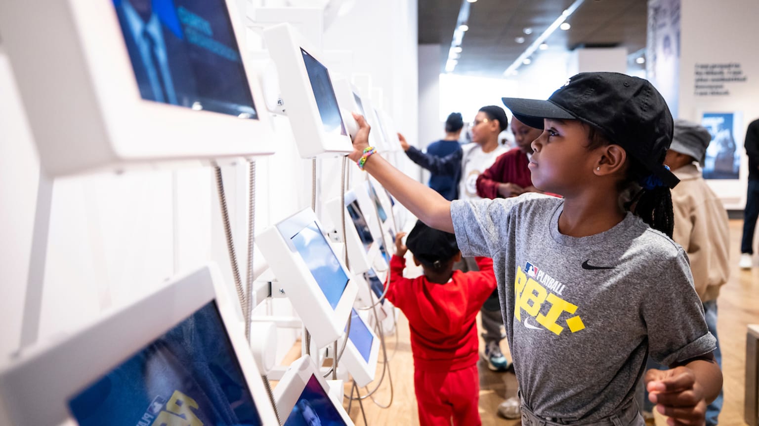 A youngster interacts with an exhibit at the Jackie Robinson Museum