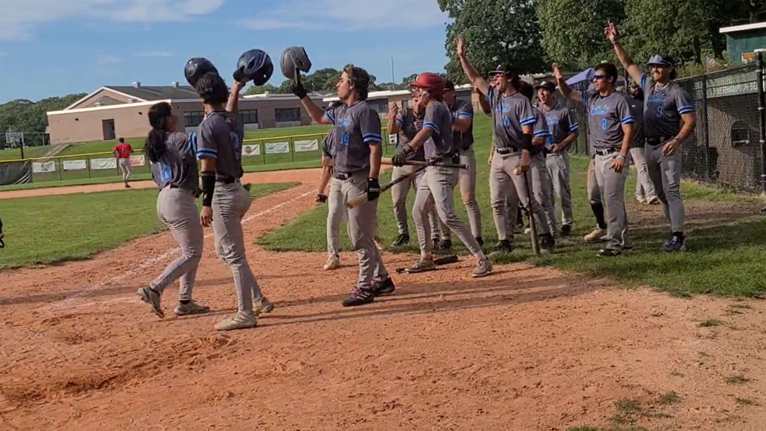 Olivia Pichardo celebrates her home run with her teammates