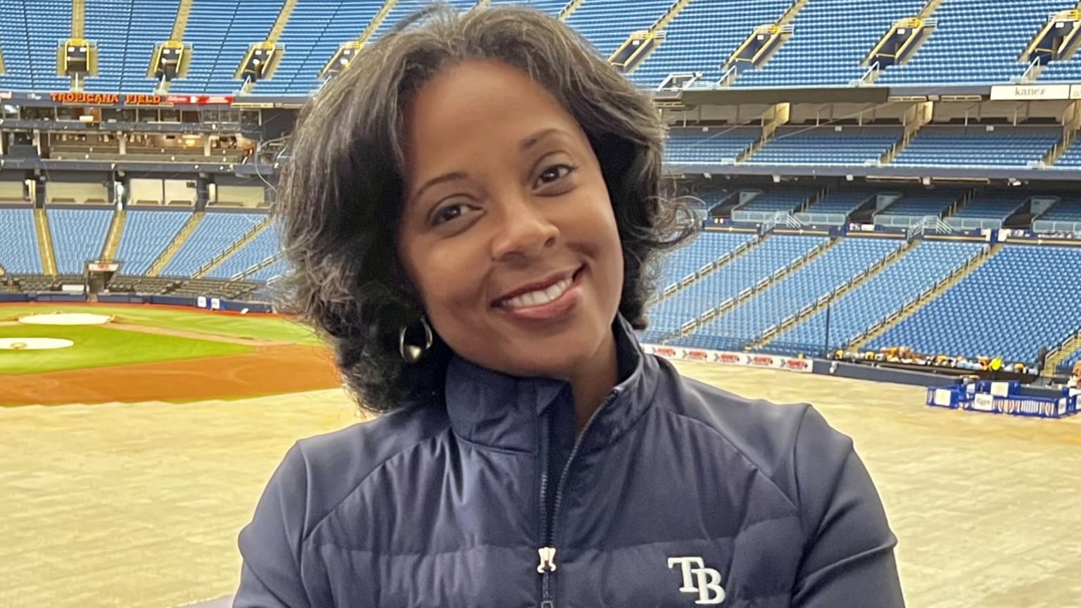 A smiling De Anna Sheffield Ward at Tropicana Field