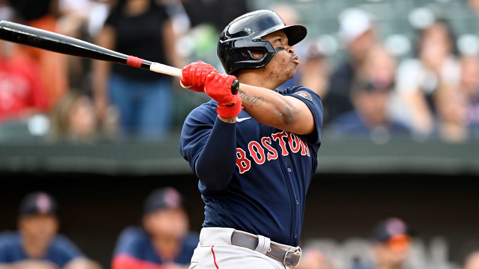 Rafael Devers follows through on a swing