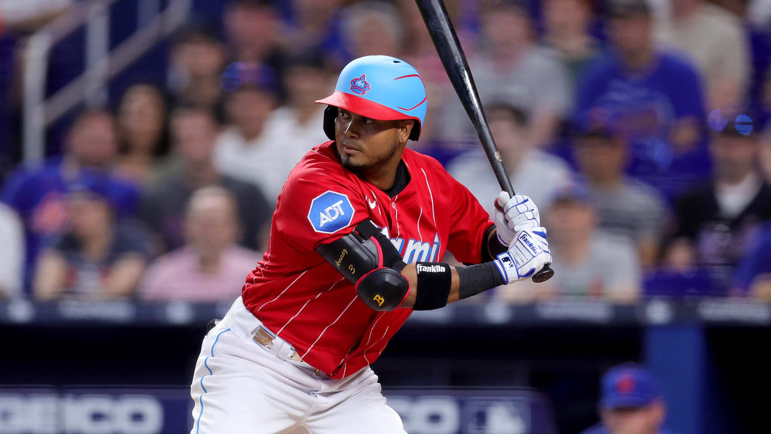 Luis Arraez waits for a pitch at home plate