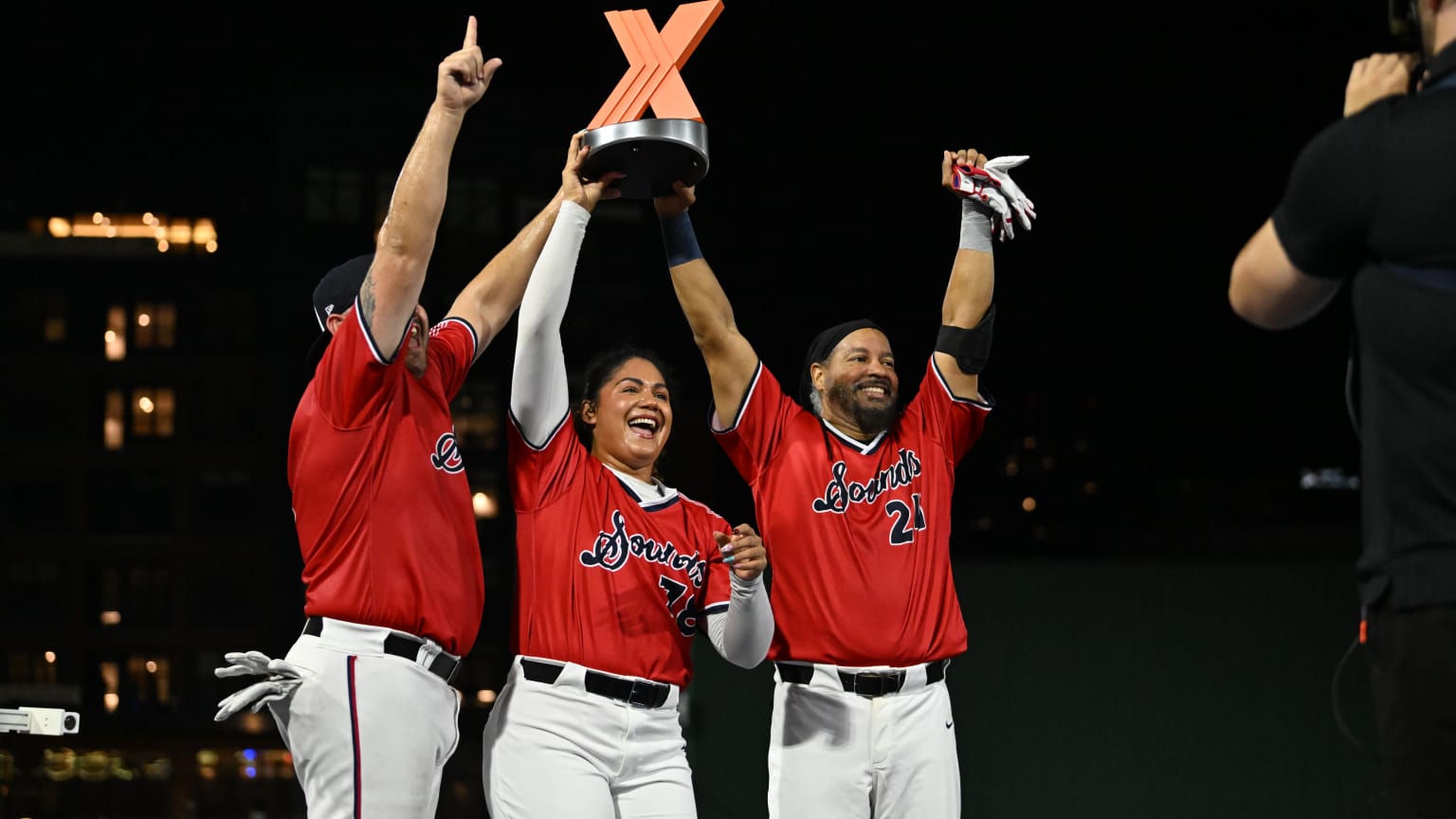 Kyle Bowers, Jocelyn Alo and Manny Ramirez celebrate