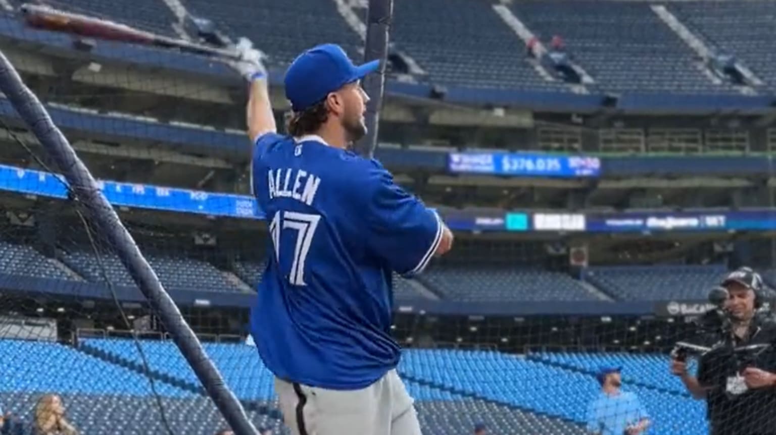 Bills quarterback Josh Allen follows through on a swing during batting practice