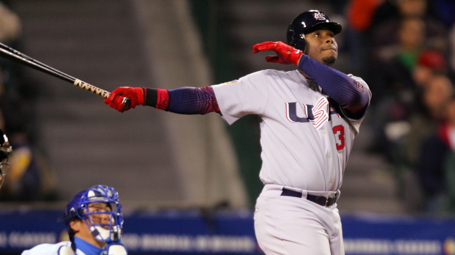 Ken Griffey Jr. follows through on a swing while playing for Team USA