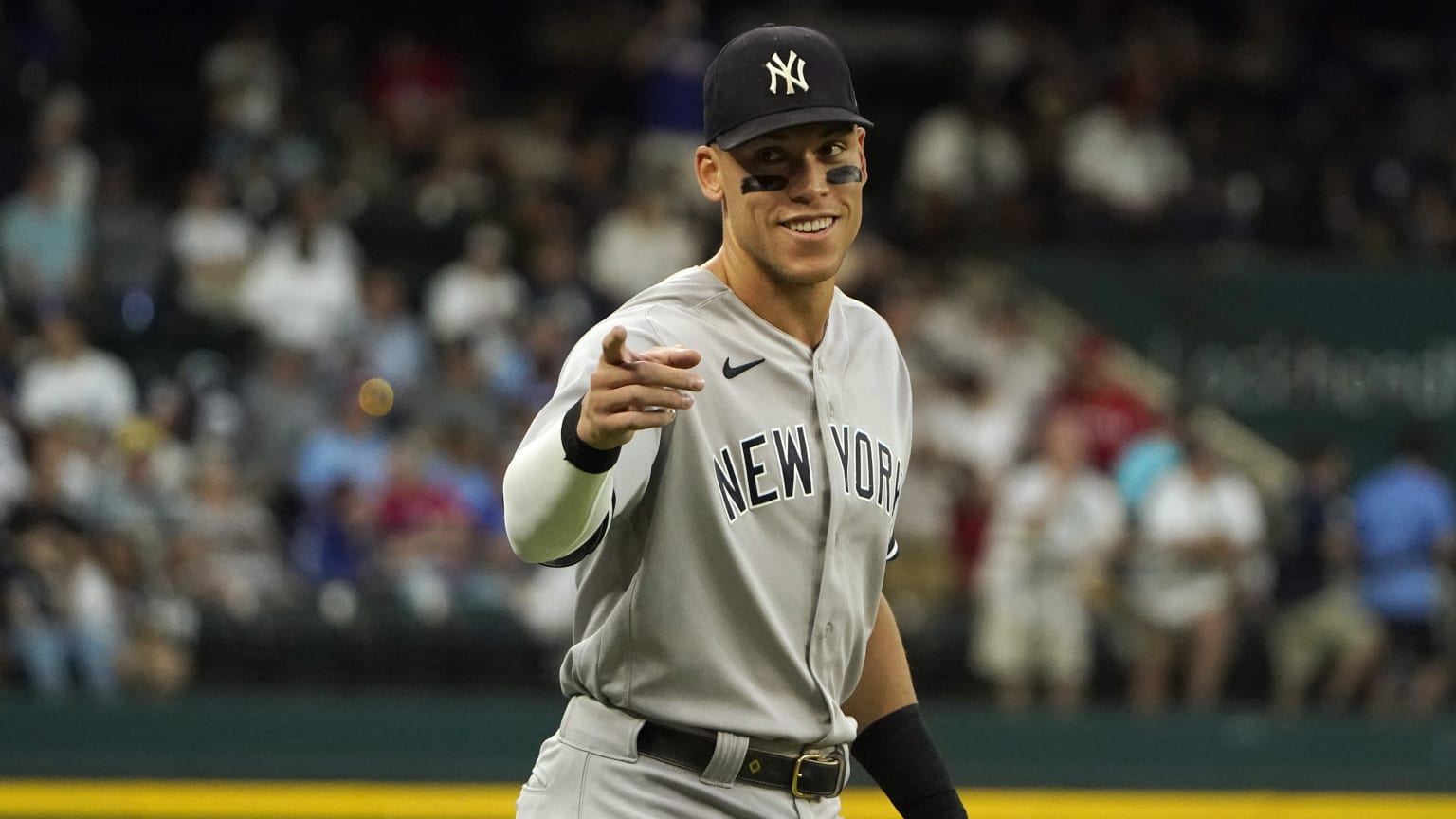 Aaron Judge points to someone from the field