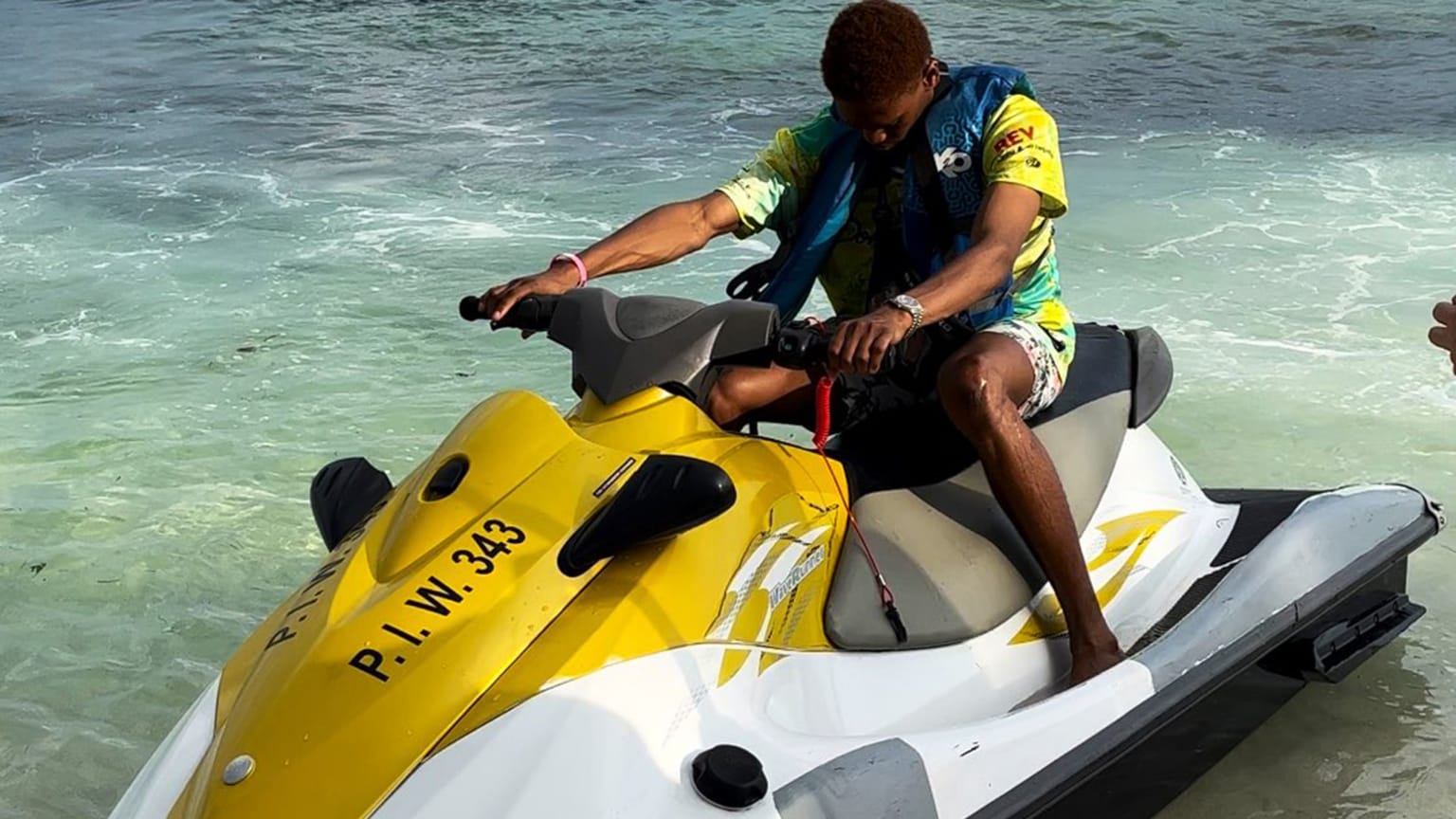 Triston McKenzie sits on a jet ski