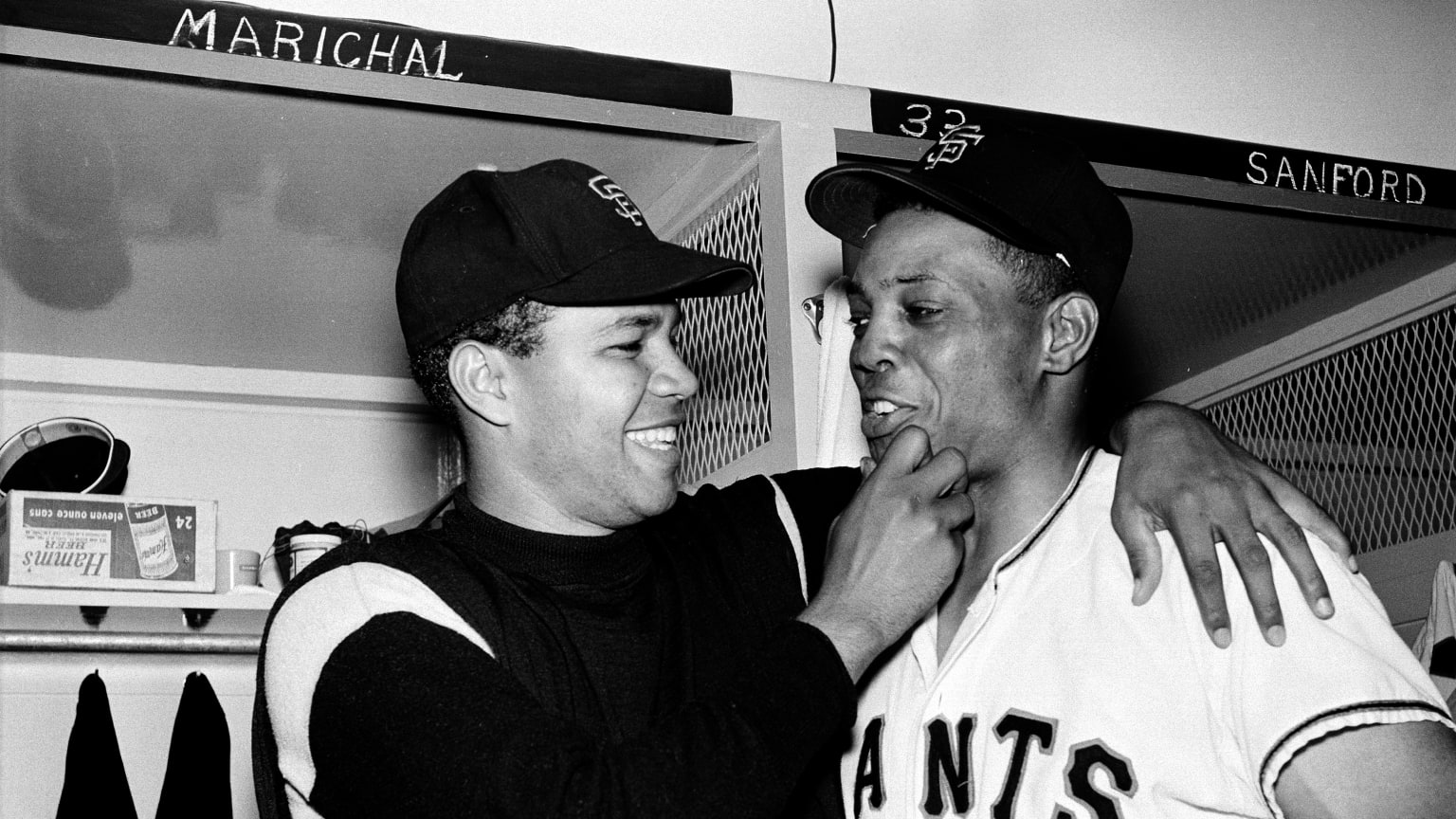 A black-and-white photo of Juan Marichal with Giants teammate Willie Mays