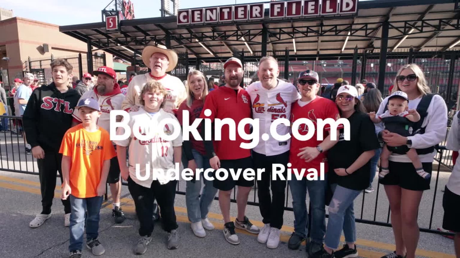 Former pitcher Ryan Dempster poses with fans while wearing a Cardinals jersey