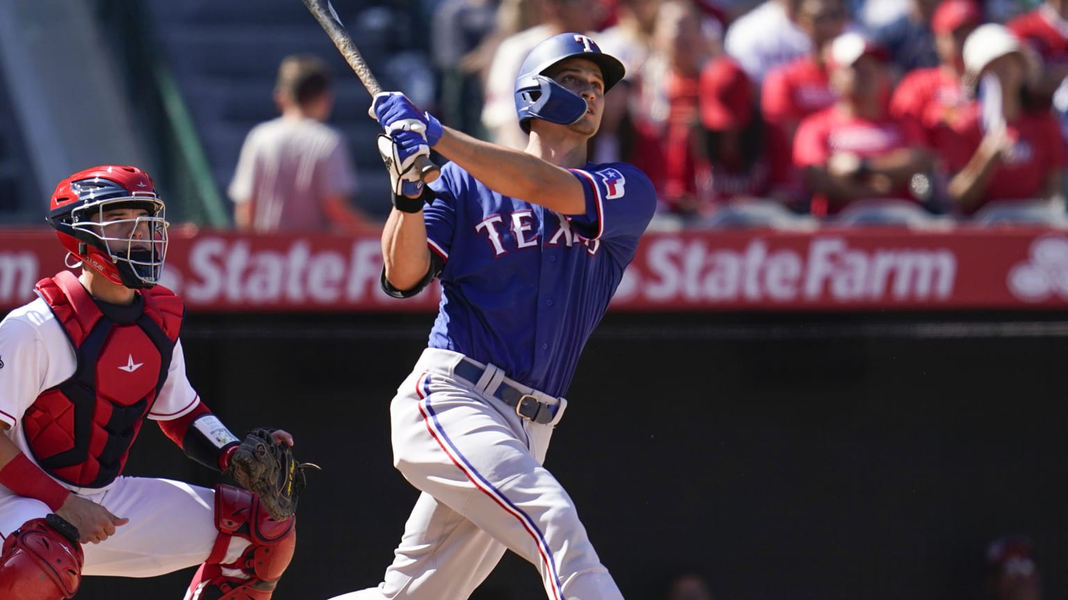 Corey Seager follows through on a swing