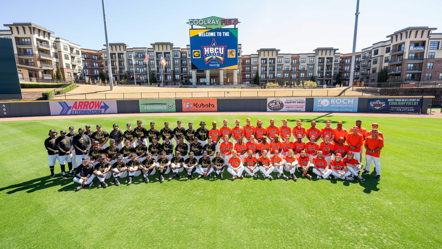 The rosters of Grambling State and Florida A&M take a group photo together