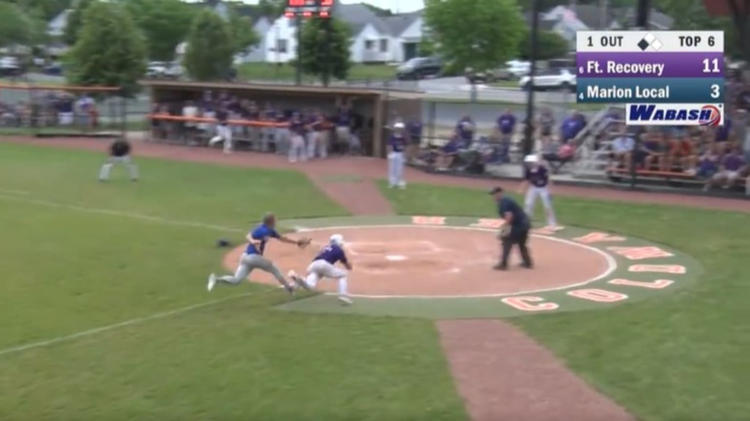 A screen grab of a play at the plate