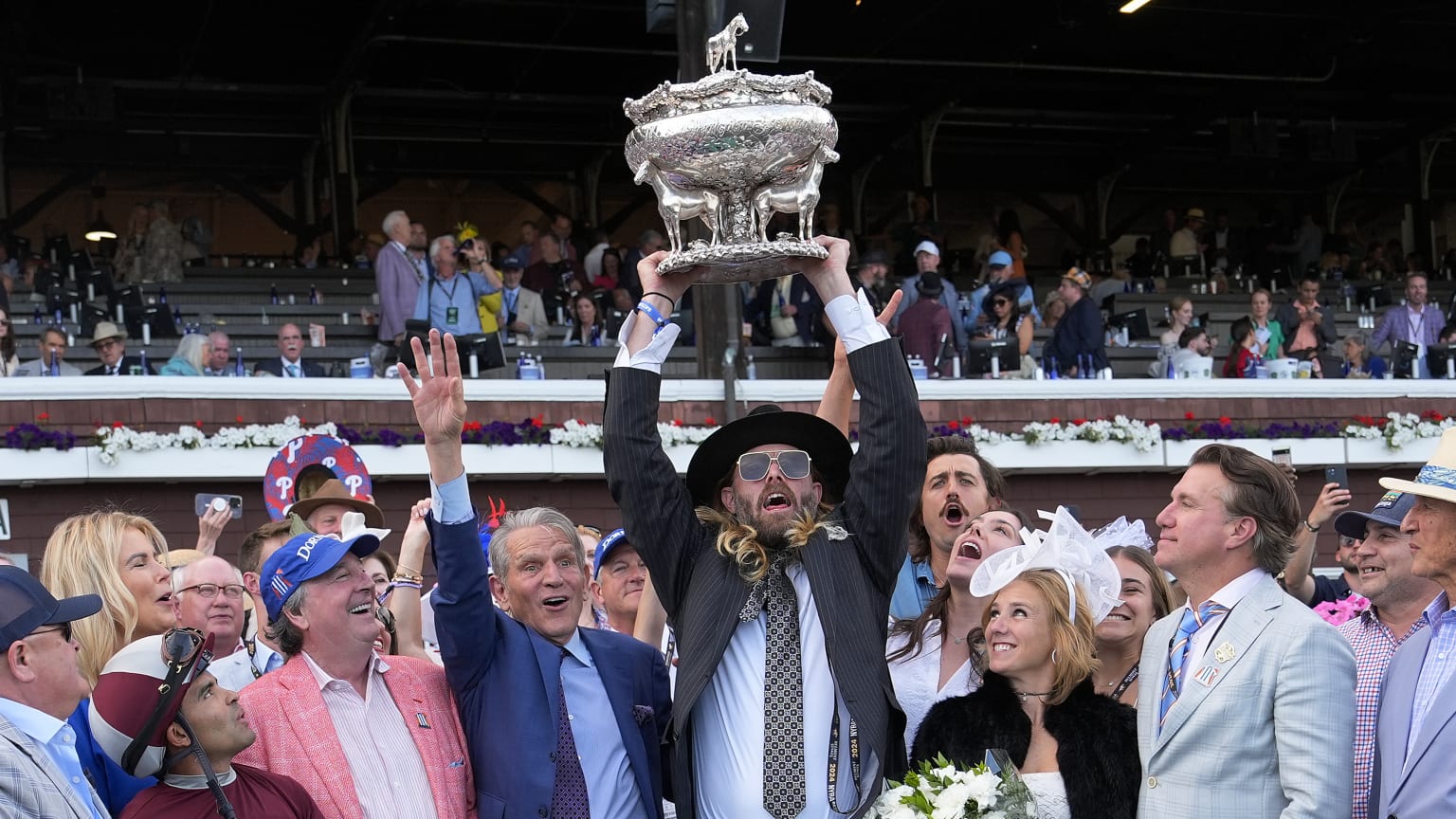 Former Major Leaguer Jayson Werth hoists Belmont Stakes trophy