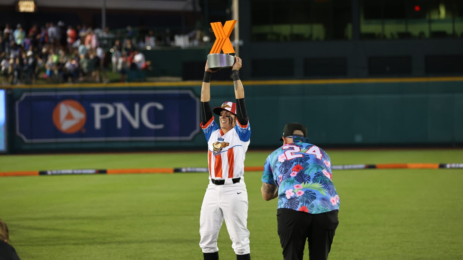 Alex Hugo lifts the Home Run Derby X trophy