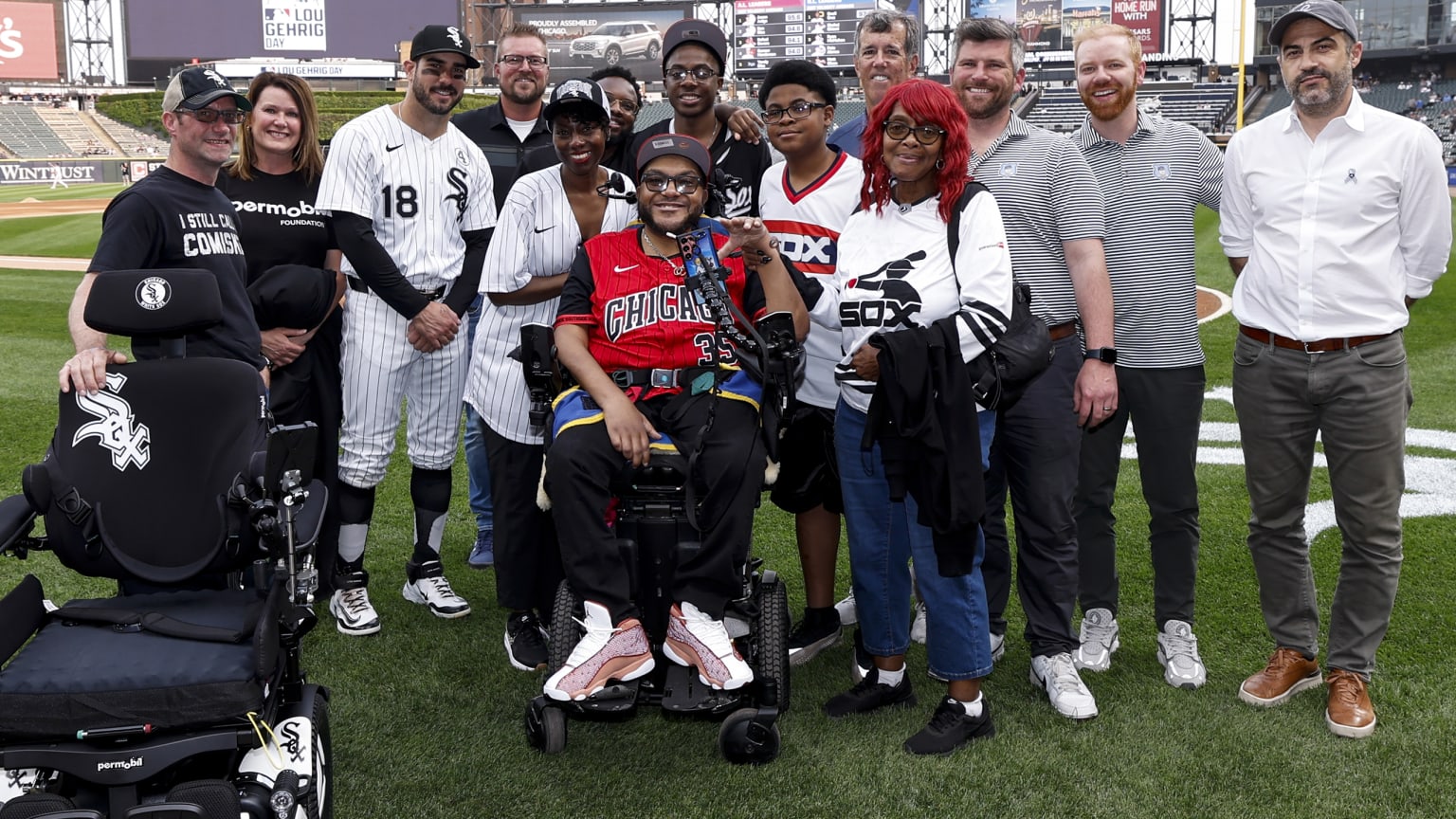 Kenneth Anthony Moore Sr. with his family on the field before Monday's White Sox game